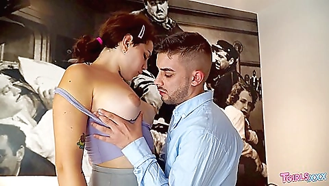 Busty brunette with tattooed breasts takes part in anal