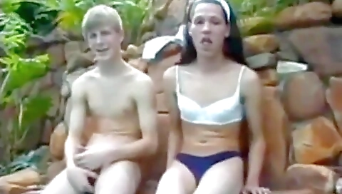 A really nice brunette is showing her body off outdoors