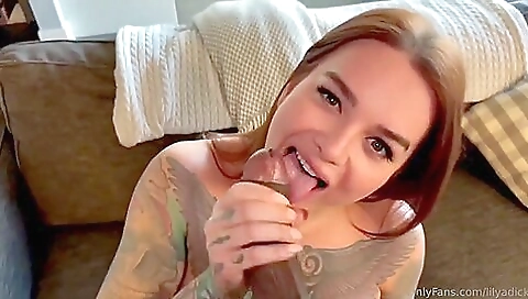 Busty shemale with a tattooed ass sucks a black cock in her anus