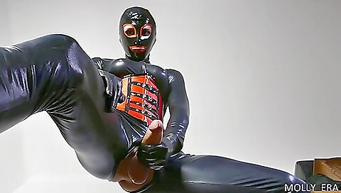 Latex fetish masturbation with the naked mistress licking it